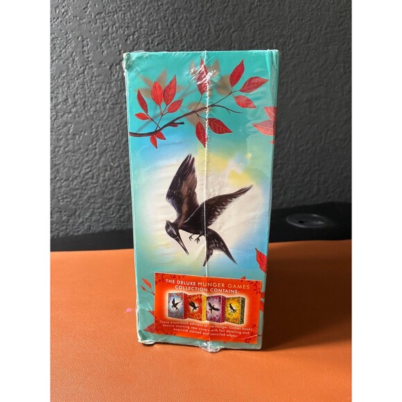 The Deluxe Hunger Games Collection by Suzanne Collins Paper Back  4 Books - Picture 2 of 5